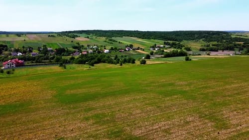 Aerial drone view of a flying over the rural agricultural landscape.