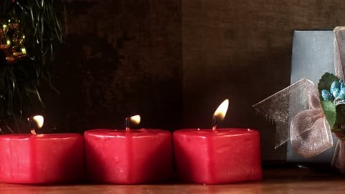 Burning Candles and Gift for Holiday Celebration
