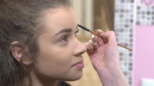 Hand of Makeup Artist Working