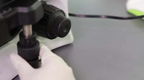 Adjusting Microscope in Lab Close Up