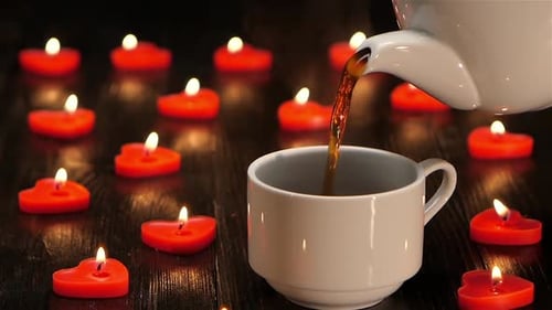 Romantic Candlelit Table with Steaming Cup