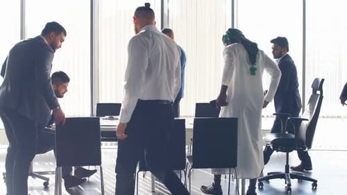 Diverse Professionals Collaborate at Modern Business Meeting