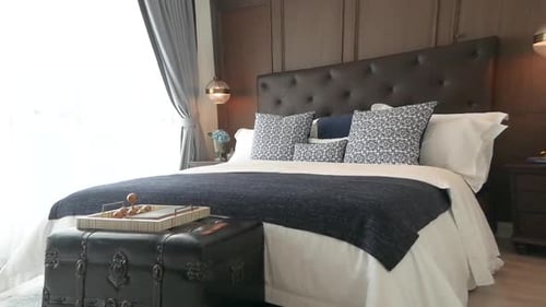 Stylish Bedroom with Elegant Bed and Vintage Trunk