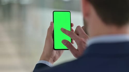 Man Using Phone with Chroma Key Screen