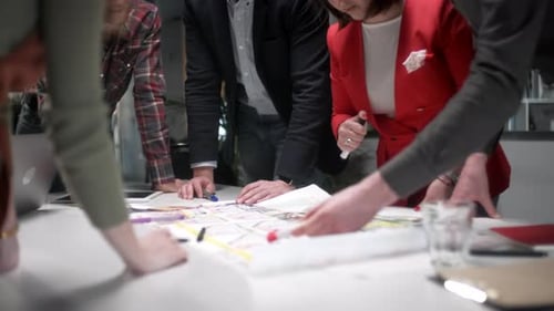 Business Team Collaborating on Project in Workplace