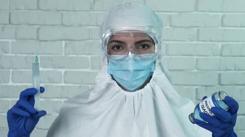 Healthcare Worker Preparing COVID Vaccine Shot