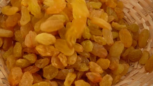 Raisins Being Poured into Basket