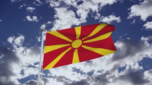 Realistic North Macedonia Flag Waving in Blue Sky with Clouds