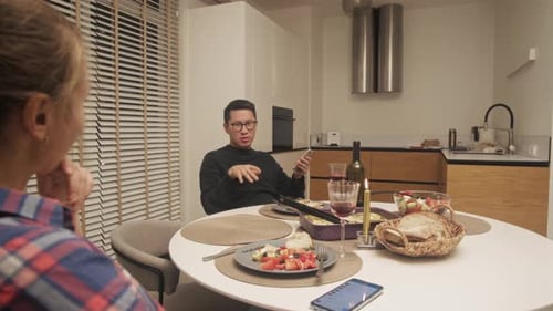 Couple dining at home