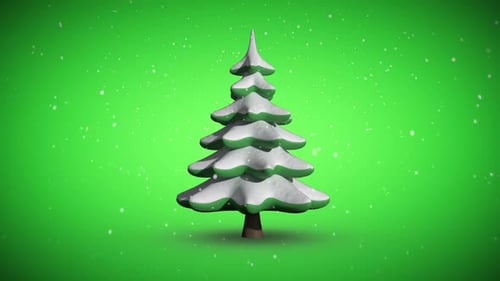 Snow falling on revolving fir tree