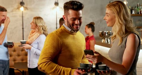 Group of Friends Chatting at Cafe with Coffee