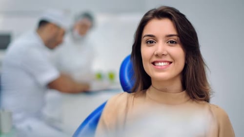 Woman Smiling in Dentist Chair Close Up