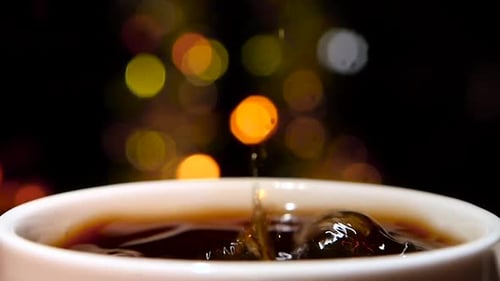 In Cup of Espresso Falls Piece of Sugar. Slow Motion