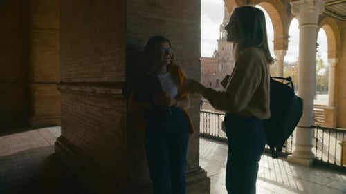 Two Friends Students Talk in University Hall