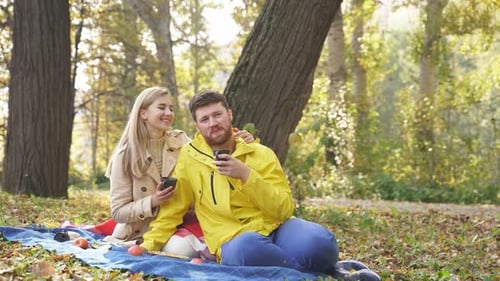 Smiling Happy Family Had a Romantic Picnic in the Autumn Park on a Sunny Day, the Happy Couple