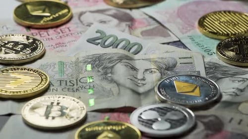 Throwing Bitcoin between cryptocurrency coins on Czech banknotes.