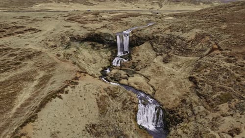 Mountain Range Surrounded By Fields Covered In Brown Grass and Moss Iceland