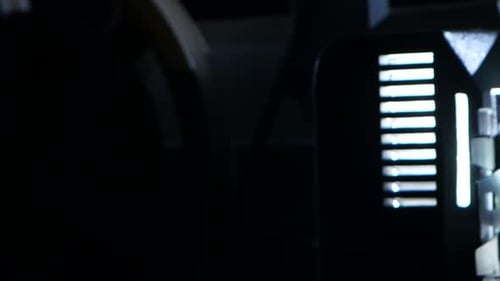 Film Projector Lens Emitting Bright Light, Reel Spinning