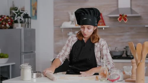 Girl Baking Festive Treats in Home Kitchen