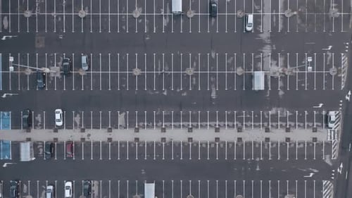 Aerial View of Urban Parking Lot with Cars