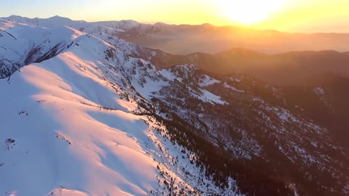 Majestic Snow-Capped Mountains at Golden Sunrise
