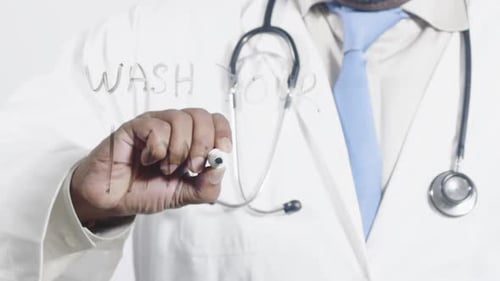 Asian Doctor Writes Wash Your Hands