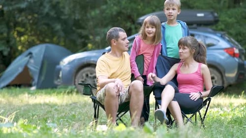 Family Camping Together in Green Nature Setting