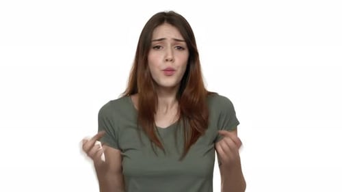 Distressed Young Woman Reacting in Studio on White