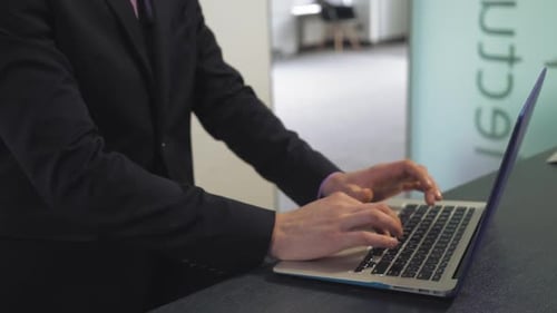 Close Up Businessman Entering on Keyboard PC