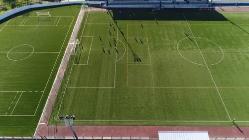 Aerial View of Soccer Practice on Green Field