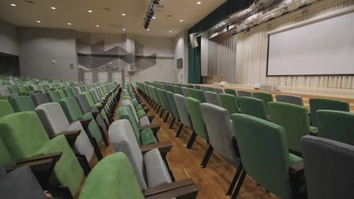 Comfortable Chairs and Screen on Stage in Conference Hall