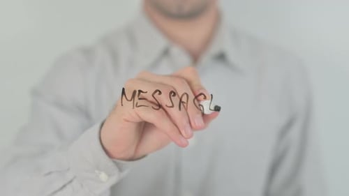 Man Writes Messageo on Transparent Surface