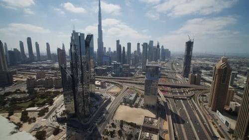 Dubai City Center with Tall Skyscrapers and Highway Traffic on a Sunny Day