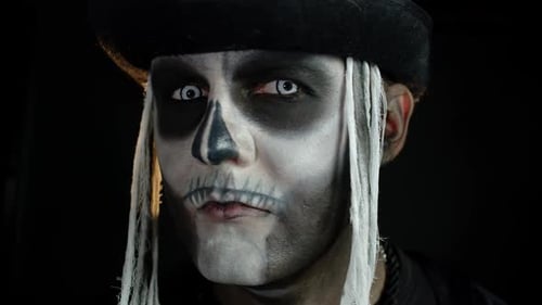 Man in Skeleton Makeup and Black Hat