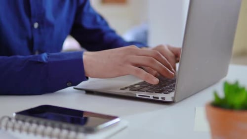 Unrecognizable Businessman Using Pc at Workplace