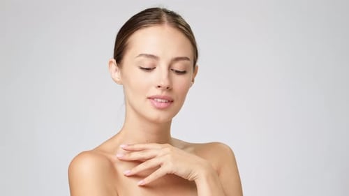 Attractive Woman Smiling Confidently in a Beauty Studio