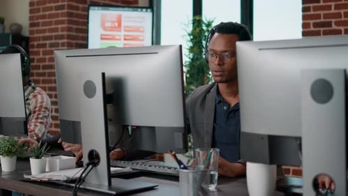 African American Employee Using Headset at Customer Service
