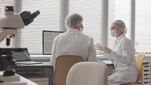Scientists Working in Modern Medical Laboratory