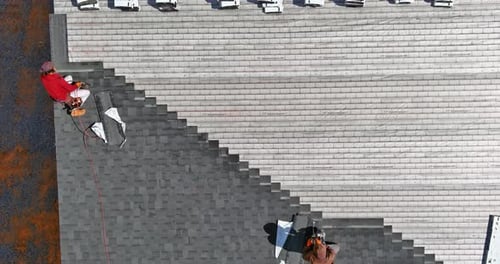Roof Installing Asphalt Shingles with New Shingles of an Building