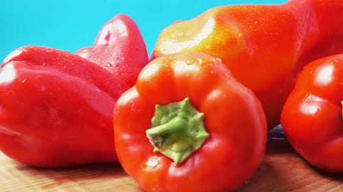 Shiny Red Bell Peppers with Water Droplets