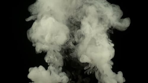 Billowing White Smoke Against Black Background