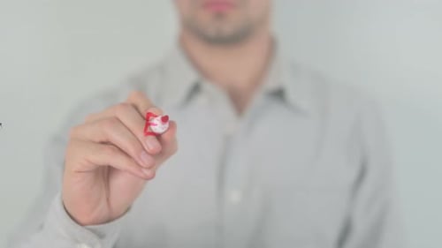 Writing 'Exclusive' With Red Marker on Clear Surface