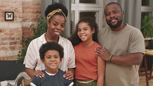 Happy Family Smiling Together at Home