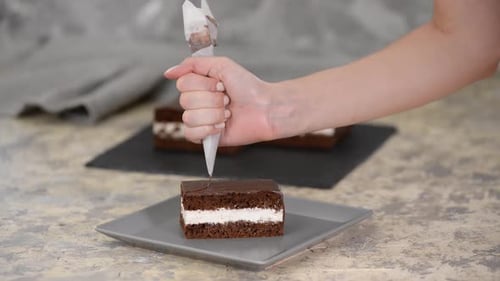 Decorating Delicious Chocolate Cake with Pastry Bag
