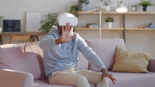 Man Using VR Headset on Couch