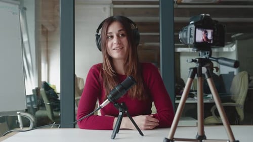 Woman Recording Podcast or Vlog in Studio