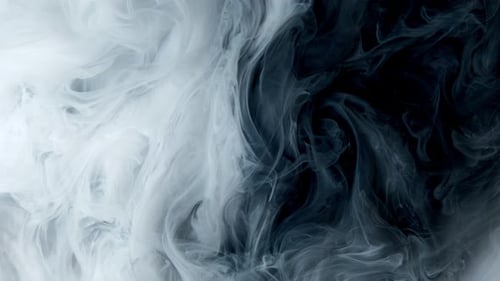 White Watercolor Ink in Water on a Black Background