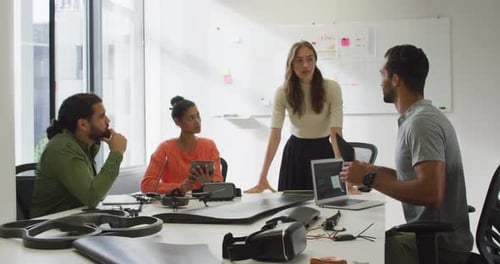 Diverse group of work colleagues brainstorming in meeting room
