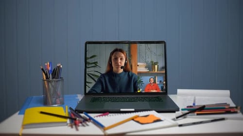 Video Conference Call on Laptop at Desk