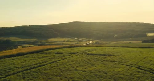 Aerial View Tourists Go Along the Hill Panoramic View of Green Fields and Meadows